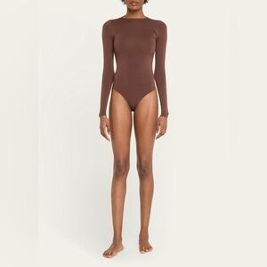 SKIMS Essential Smoothing Long-Sleeve Thong Bodysuit  Raw Cut Neckline In Cocoa